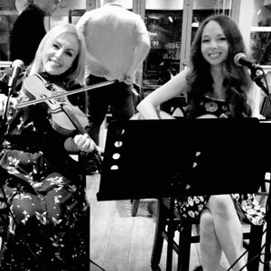 Jo and Bridget McMahon performing at a wedding
